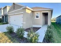 Charming single-story home with a two-car garage and well-maintained landscaping at 994 King Parc Rd, Orange City, FL 32763