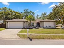 Charming single-story home with a well-manicured lawn and a classic design at 520 Balsawood Ct, Altamonte Springs, FL 32714