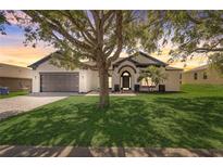 Charming single-story home with a well-manicured lawn, inviting front porch, and neutral color palette at 116 Brookshire Dr, Lake Wales, FL 33898