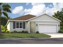 Charming single-story home featuring a two-car garage, neutral colors, and well-maintained landscaping at 1210 Normandy Dr, Haines City, FL 33844