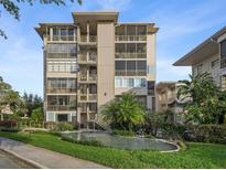 Stunning condominium building with beautiful landscaping, fountain, and secure access for elegant living at 311 E Morse Blvd # 6-7, Winter Park, FL 32789