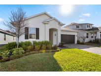 Charming single-Gathering home with a well-manicured lawn and freshly planted landscaping, inviting curb appeal at 4418 Lions Gate Ave, Clermont, FL 34711