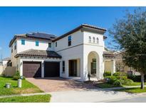 Elegant two-story home with a two-car garage, covered entry, and well-maintained landscaping at 14645 Scott Key Dr, Winter Garden, FL 34787