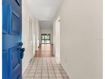 Bright entryway featuring tile flooring and a glimpse of the living area at 15 Escondido Ct # 145, Altamonte Springs, FL 32701