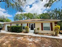 Charming single story home with neat landscaping and a well maintained front yard at 511 Terrier Way, New Smyrna Beach, FL 32168
