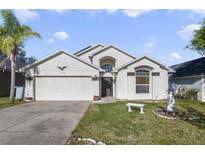 Charming single-Gathering home with a well-maintained lawn and a two-car garage in a sunny locale at 1110 Stoneham Dr, Groveland, FL 34736