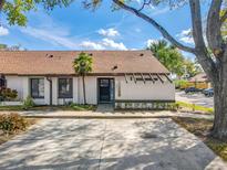 Inviting one-story home with a well-manicured lawn and ample parking on a concrete driveway at 2471 Tahoe Cir # 00, Winter Park, FL 32792