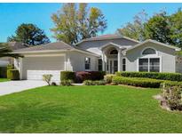 Charming single-story home with well-maintained landscaping and inviting curb appeal at 3960 Villas Green Cir, Longwood, FL 32779