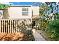 Charming two-story home featuring a fenced yard and well-maintained landscaping at 533 Moree Loop, Winter Springs, FL 32708