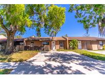 Charming single-story home with a clean front facade and ample parking space at 3143 Stonecastle Rd, Orlando, FL 32822