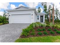 Charming one-story home featuring a well-manicured lawn and a two-car garage at 1276 Jackson Hole Ct, Deland, FL 32724