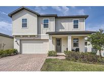 Charming two-story home featuring a two-car garage, and well-maintained landscaping at 2277 Crossbow St, Clermont, FL 34715