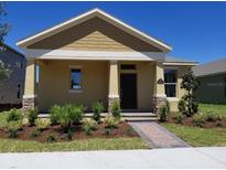 Charming single-story home with a manicured front yard and inviting covered entryway at 16749 Harper Cove Dr, Winter Garden, FL 34787
