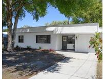 Charming single-story home featuring a clean white facade, well-manicured landscaping, and a welcoming entrance at 2429 Yale Ave, Sanford, FL 32771