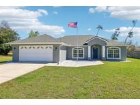 Charming single-story home with a well-manicured lawn and an American flag proudly displayed at 10367 Sw 45Th Ave, Ocala, FL 34476