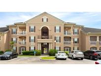 Attractive condo building with balconies, parking, and well maintained landscaping at 14316 Fredricksburg Dr # 507, Orlando, FL 32837
