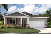 Charming single-Gathering home with stone accents, a two-car garage, and well-maintained landscaping at 33436 Seattle Slew Dr, Sorrento, FL 32776