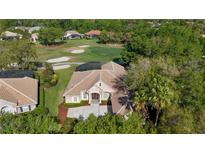 Stunning single-story home featuring a well-manicured lawn and located on a picturesque golf course at 3400 Park Grove Ct, Longwood, FL 32779