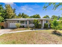 Charming single-story home features a well-manicured lawn, painted exterior, and attached garage at 541 Meridale Ave, Orlando, FL 32803