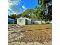 Charming single-story home with a well-maintained lawn, inviting entrance, and mature trees at 613 20Th St, Orlando, FL 32805