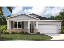 Charming one-story home featuring stone accents, gray shutters, and a well-manicured lawn at 1347 Wood Line Dr, Deland, FL 32720