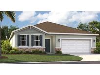 Charming one-story home featuring a manicured lawn and a two-car garage, complemented by a stone facade and neutral color palette at 1351 Wood Line Dr, Deland, FL 32720
