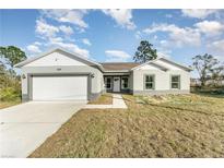 Charming single-story home featuring a two car garage, well-manicured lawn, and inviting curb appeal at 1639 Pickerel Ct, Kissimmee, FL 34759