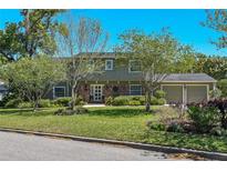 Charming two-story home with well-manicured lawn and mature trees for shade at 1621 Chippewa Trl, Maitland, FL 32751