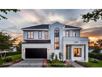Stunning two-story modern home with a black garage door and manicured lawn at 1803 Florinda Dr, Orlando, FL 32804