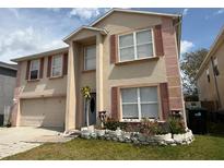 Charming two-story house featuring a well-kept lawn, neutral paint, and classic shutters at 3024 Natoma Way, Orlando, FL 32825