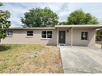 Charming single-story home featuring a well-maintained front yard and neutral exterior paint at 701 N 4Th St, Haines City, FL 33844