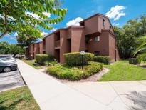 Well-maintained condominium building with mature landscaping and ample parking at 1092 E Michigan St # 1, Orlando, FL 32806