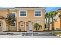 Charming two-story townhome featuring a private entrance, well-kept landscaping, and convenient parking at 2608 Roadster Ln, Kissimmee, FL 34746
