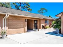 Charming one-story home with attached garage, covered entry and front yard landscaping at 140 Pinesong Dr, Casselberry, FL 32707