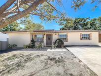 Charming single-story home with a well-manicured front yard and a cozy, inviting entrance at 2342 Linda St, Lake Wales, FL 33898