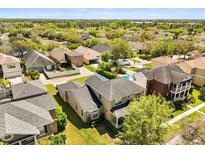 Expansive aerial view of the neighborhood showcasing lush greenery and surrounding homes at 2531 Seabranch St, Orlando, FL 32828