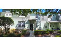 Charming two-story townhome with stone accents, a welcoming entrance, and well-maintained landscaping at 4730 Capital Blvd, St Cloud, FL 34769