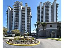 Luxury condos showcase modern architecture, fountain, and manicured landscaping enhancing curb appeal at 13427 Blue Heron Beach Dr # 1802, Orlando, FL 32821