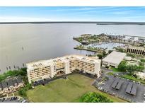 Stunning aerial view of condo building near a scenic waterfront and marina at 225 W Seminole Blvd # 409, Sanford, FL 32771