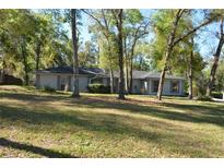 Charming one-story home with a well-maintained lawn and mature trees offering shade and curb appeal at 308 Tangerine St, Altamonte Springs, FL 32701