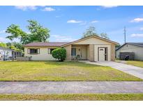 Charming single-story home with well-maintained lawn and front door at 870 Darwin Dr, Altamonte Springs, FL 32701