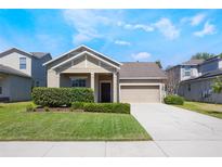 Charming single-story home with well-maintained lawn and lush landscaping, inviting curb appeal at 1155 Seburn Rd, Apopka, FL 32703