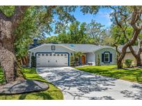 Charming single-story home featuring a spacious driveway and a well-manicured lawn at 878 W Timberland Trl, Altamonte Springs, FL 32714
