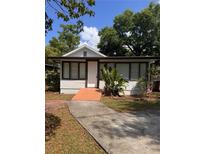 Charming single-story home with a brick walkway and well-maintained landscaping at 625 Citrus St, Orlando, FL 32805