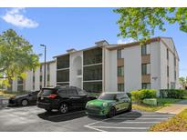 Well-maintained condo building with screened balconies and assigned parking in a quiet community at 8217 Sun Spring Cir # 41, Orlando, FL 32825