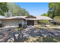 Charming single-story home with a two-car garage, front lawn, and inviting front door under blue skies at 9900 W Lake Marion Rd, Haines City, FL 33844