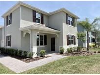 Charming two-story home showcasing a covered porch and well-manicured landscaping at 3024 Meleto Blvd, New Smyrna Beach, FL 32168