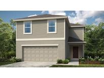 Two-story home with neutral siding, a two-car garage, and neatly landscaped shrubbery at 326 Wayland Dr, Haines City, FL 33844