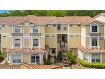 Inviting condo community showcases a well-maintained building with classic architectural details and a vibrant landscape at 692 Seabrook Ct # 103, Altamonte Springs, FL 32714