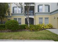 Inviting facade with manicured landscaping, a covered entrance, and charming architectural details at 8180 Boat Hook Loop # 105, Windermere, FL 34786